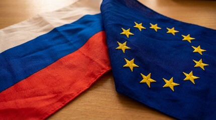 European Union and Russian Federation flags on a wooden surface