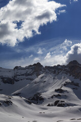 Snow mountains and blue sky with clouds