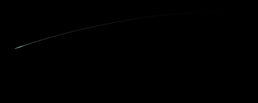 Banner with different types of comets crossing space, on a black background
