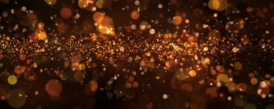 Beautiful horizontal banner with a bokeh effect in golden colors on a black background