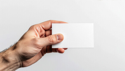 Obraz premium Blank Business Card Mockup Held by Hand With Extreme Copy Space on White Background