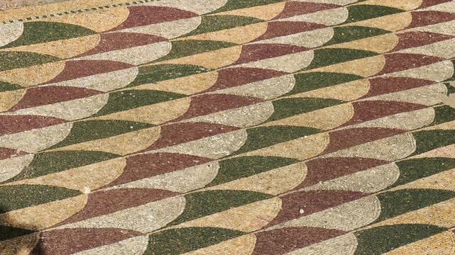 ancient roman mosaic floor baths caracalla fish scale pattern earthy green brown beige tesserae intricate design of rome italy emperor 