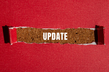 Update message written on ripped torn paper background. Conceptual Update symbol. Copy space.