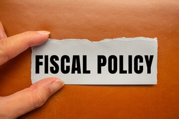 Fiscal Policy message written on ripped torn paper background. Conceptual Fiscal Policy symbol. Copy space.