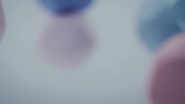 Soft, blurred abstract of geometric shapes in pastel tones, with a sense of depth and subtlety