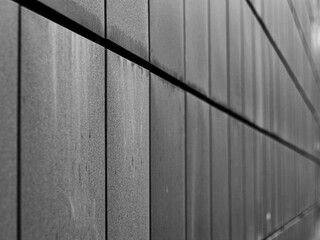 Abstract geometric background of dirty rectangular wall panels 