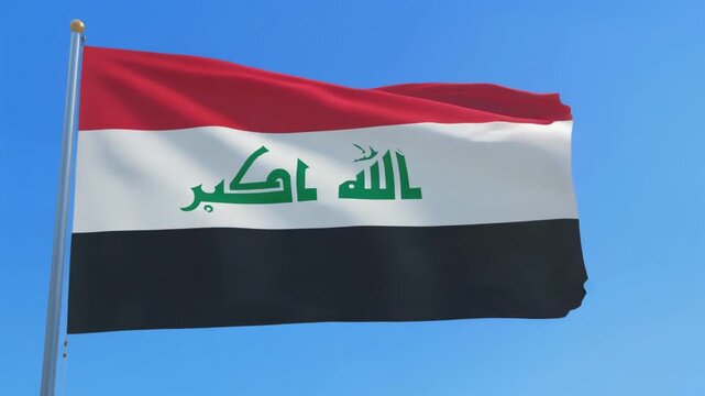 Iraq flag waving under clear blue sky.