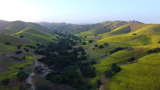 Lush green hills and winding valley hiking paths during spring. Calm tranquil atmosphere, and layered terrain ideal for wellness, nature, environmental, and renewal Cheseboro Canyon Agoura Hills