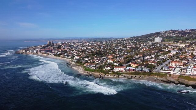La Jolla Beach, San Diego. Drone View of Residential Neighborhood along Coastal Tidal Waters on Clear Sunny Day. Luxury Ocean Beachfront Real Estate.