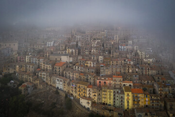 Sunrise view of the rooftops of Gangi with morning fog. Sicily, Italy. August 2024. Aerial drone picture.