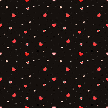 Numerous small heart shapes are scattered throughout the image. The hearts come in bright red, light pink, and cream colors. The background is in shades of black. This pattern can be used in fabrics