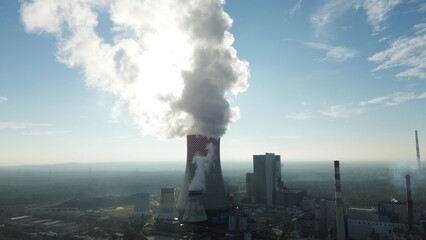 Coal-fired power plant emitting smoke into atmosphere