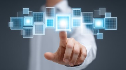 Human hand interacting with futuristic touch screen interface displaying glowing digital squares on a blurred background for technology concepts