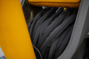 Industrial excavator hydraulic hose assembly with protective sleeve and fittings, focused on construction machinery fluid power and equipment reliability