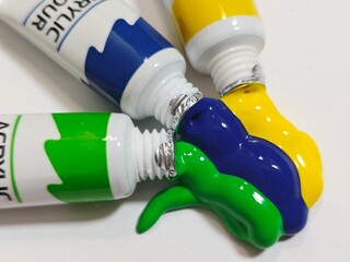 Tubes of Paint Squeezing Out Colors.