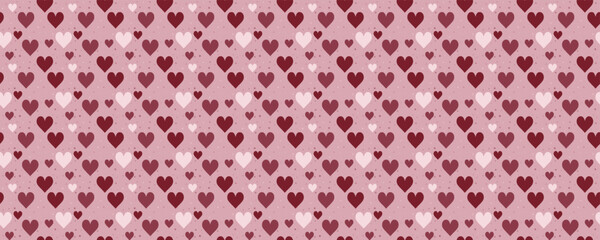 Seamless heart pattern with pink and red hearts on soft background. Cute love print perfect for Valentine's Day cards, gift wrap, or romantic wedding decor and greeting designs.