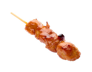 A single grilled meat skewer with a glossy glaze isolated on a white background.