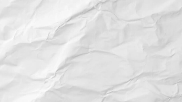 Abstract textured background of white crumpled paper with wrinkles and folds
