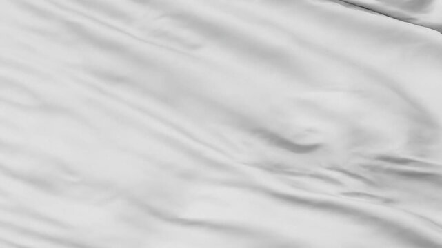 Close-up of a luxurious white silk fabric with soft folds and light reflections