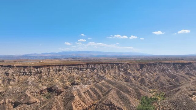 Aerial across the extraordinary badlands geographical forms of Guadix Granada