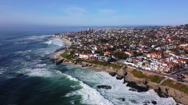 Windansea, La Jolla Beach, San Diego. Drone View of Residential Neighborhood along Coastal Tidal Waters on Clear Sunny Day. Luxury Ocean Beachfront Real Estate. Looking North Towards LA.
