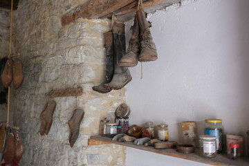 Traditional Leather Shoes Hanging on Workshop Wall