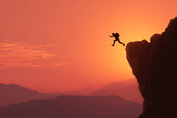 silhouette of a backpacker jumping off a cliff at sunset