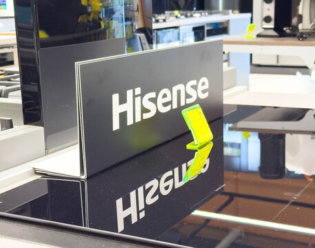 Zagreb, Croatia - December 17, 2025: Hisense brand display sign reflected on glossy surface in modern electronics store showcasing innovative technology and consumer electronics