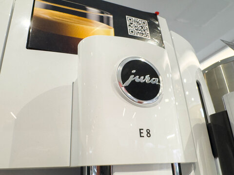 Zagreb, Croatia - December 17, 2025: Jura E8 coffee machine showcasing sleek design and modern technology, perfect for coffee enthusiasts and home baristas seeking quality brewing experience