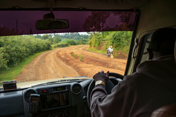 Rural life seen from the dirt road of people working and living