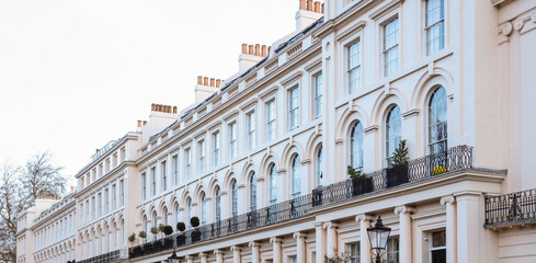 London elegant residential street showing historical Regency architecture, luxury terrace...