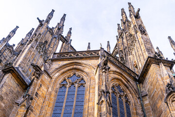 Spires of towers Gargoyle Saint Vitus Cathedral church in Prague Czech Republic. Gothic architecture of Praha Castle old ancient building house window