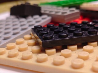 Fototapeta premium Bricks Closeup with Black and Beige Blocks.