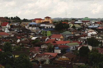crowded residential area with colorful rooftops in a tropical town