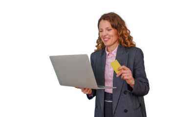 Woman in business suit holding laptop and credit card while shopping online, making e-commerce payment