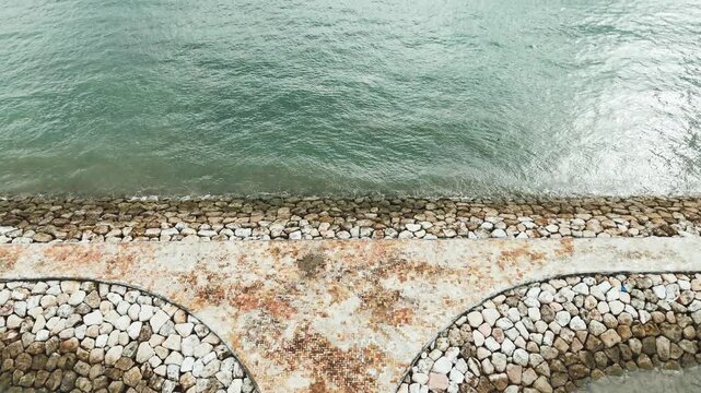 Aerial View of T-Shaped Stone Breakwater at Sanur Beach in Bali