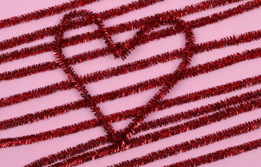 red glitter heart shape on pastel background. Romantic decorative pattern for Valentine's day, love concept.