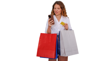 Woman shopping online with smartphone and credit card, holding paper shopping bags, digital payment and e-commerce concept