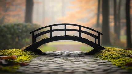 A miniature wooden bridge with intricate railings gracefully arches over a cobblestone path in a serene garden setting with blurred autumn foliage in the background