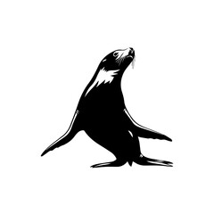 Black silhouette of a sea lion or seal standing upright, looking towards the sky. © Maulana