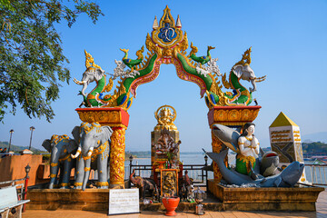 Fototapeta premium Ornate Lanna-style gateway at the Golden Triangle Park (Sop Ruak) on the banks of the Mekong River in Chiang Saen in Northern Thailand