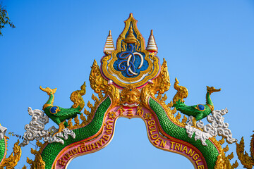 Obraz premium Ornate Lanna-style gateway at the Golden Triangle Park (Sop Ruak) on the banks of the Mekong River in Chiang Saen in Northern Thailand