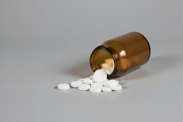 Prescription medicine spill on clinical grey, pharmaceutical healthcare concept