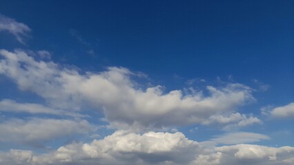 White Cottony Cumulus Clouds in Blue Sky