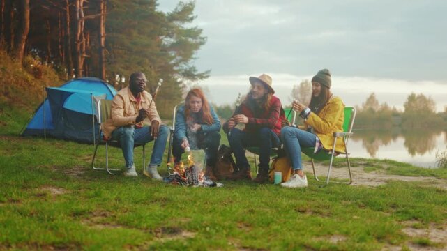 Peaceful outdoor gathering, Lakeside friends share stories, Campfires smoldering under pine trees near calm lake