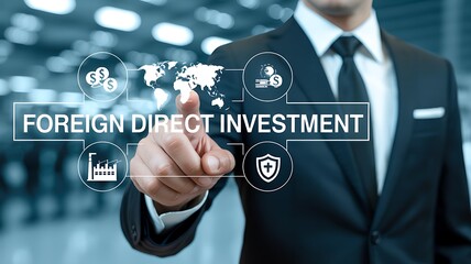 A businessman in a suit gestures towards a glowing display illustrating foreign direct investment concepts and global economic connections high quality