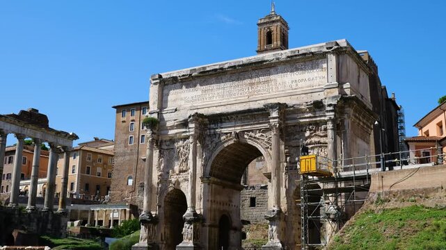 arch septimius severus stands amid roman forum carved marble reliefs latin inscriptions nearby ruins highlight foro di cesare rome italy empire emperor of 