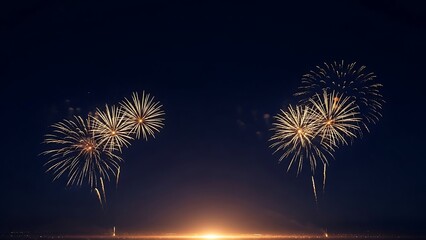 Spectacular golden fireworks illuminate the night sky creating a stunning festive display