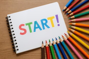 色鉛筆で描かれたSTARTの文字がノートに並び学習や新しい挑戦の始まりを前向きに伝えるイメージ