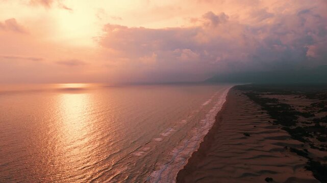 Patara Beach with its golden sand dunes stretch along crystal-clear turquoise water, one of the longest and most unspoiled beaches in Antalya, Turkey.